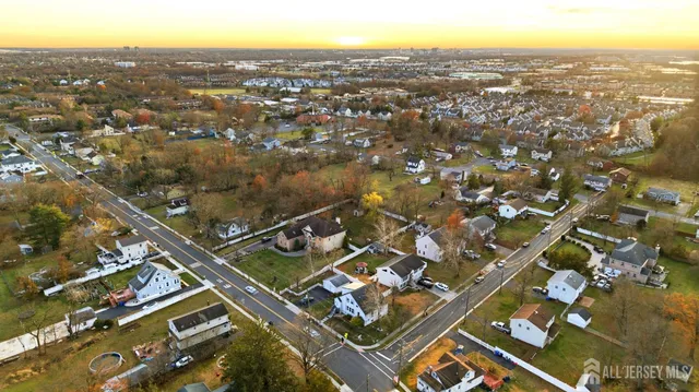 an aerial view of residential building with parking
