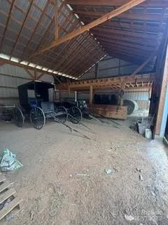 a view of room with furniture and a table