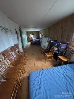 a view of an empty room with kitchen