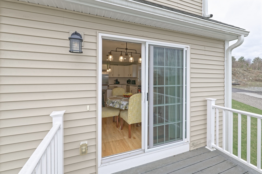 1202 Hazelwood Way, Unit 1202 Clinton, MA 01510 - Photo 16 of 38 a view of wooden door and a window