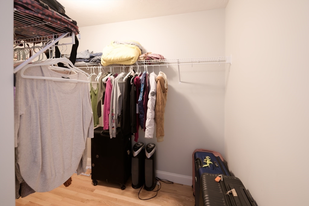 1202 Hazelwood Way, Unit 1202 Clinton, MA 01510 - Photo 20 of 38 a view of walk in closet with clothes and shoes