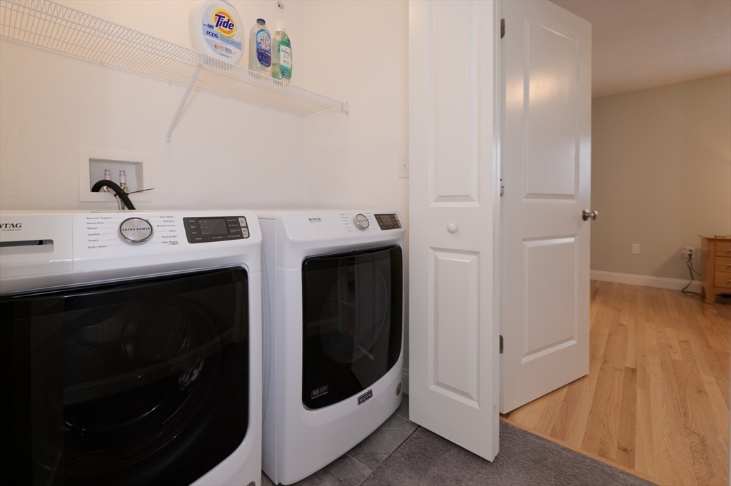 1202 Hazelwood Way, Unit 1202 Clinton, MA 01510 - Photo 28 of 38 a utility room with dryer and washer
