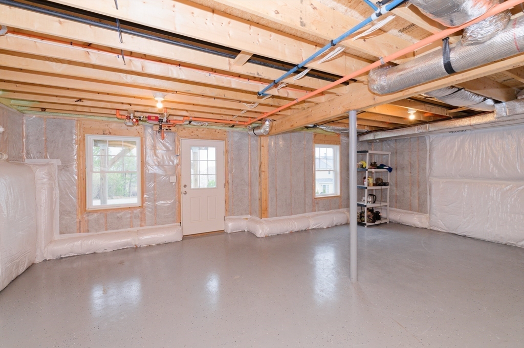 1202 Hazelwood Way, Unit 1202 Clinton, MA 01510 - Photo 29 of 38 a view of an empty room with a window