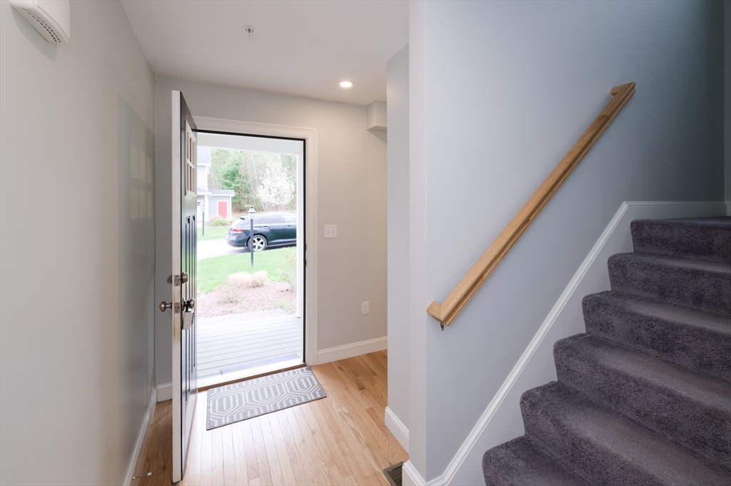 1202 Hazelwood Way, Unit 1202 Clinton, MA 01510 - Photo 3 of 38 a view of entryway and hall with wooden floor