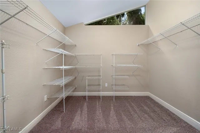 a view of an empty walk in closet