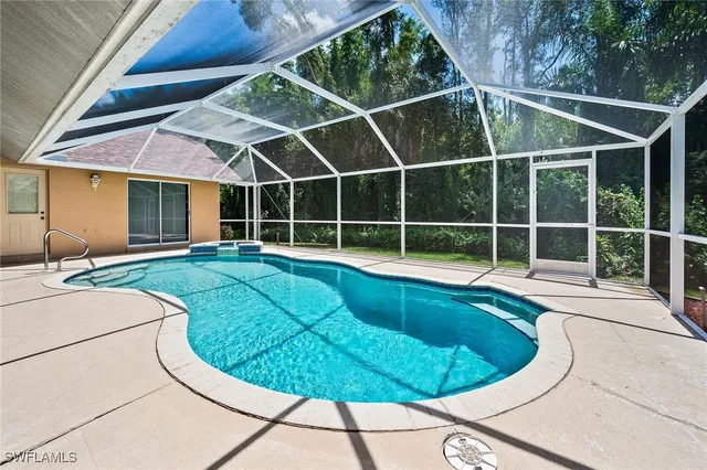 a view of a swimming pools under an umbrella