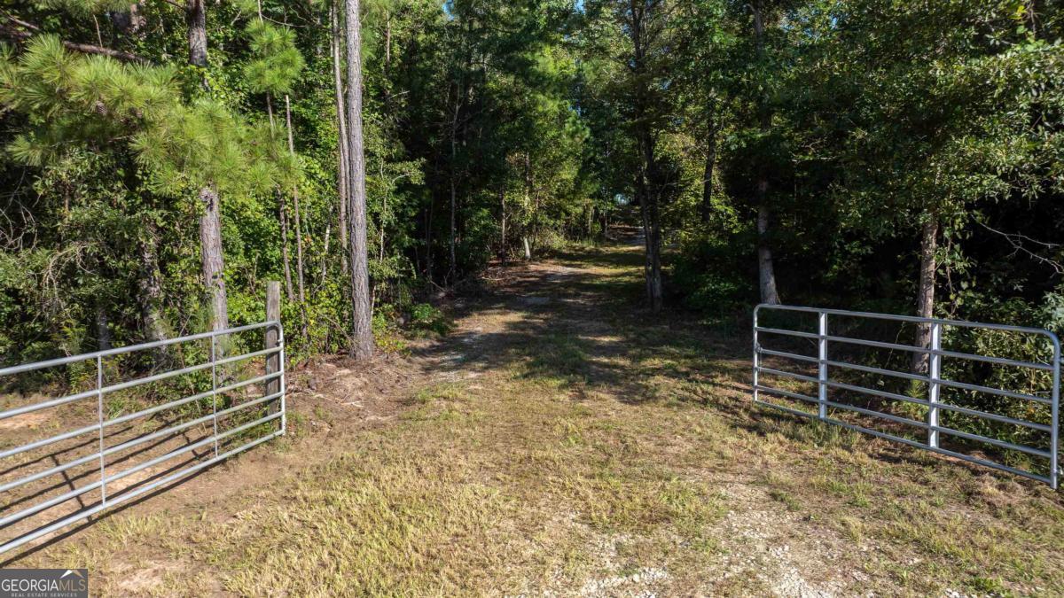 1901 Grey Land Road Greensboro, GA 30642 - Photo 19 of 36 a view of an empty room with stairs
