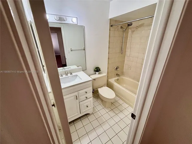 a bathroom with a sink a mirror and a shower