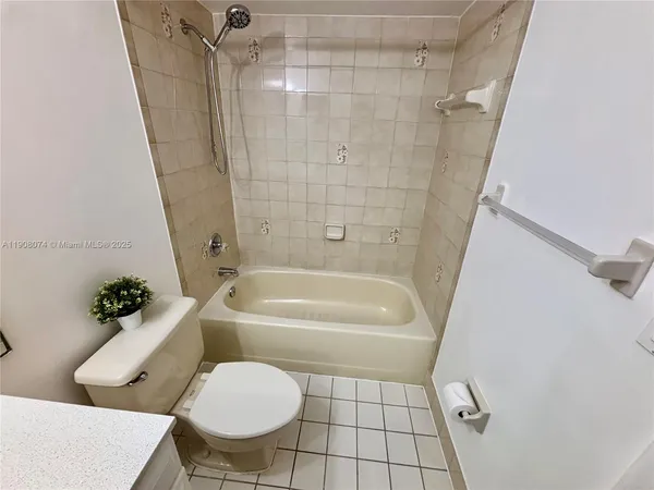 a bathroom with a toilet and a bathtub