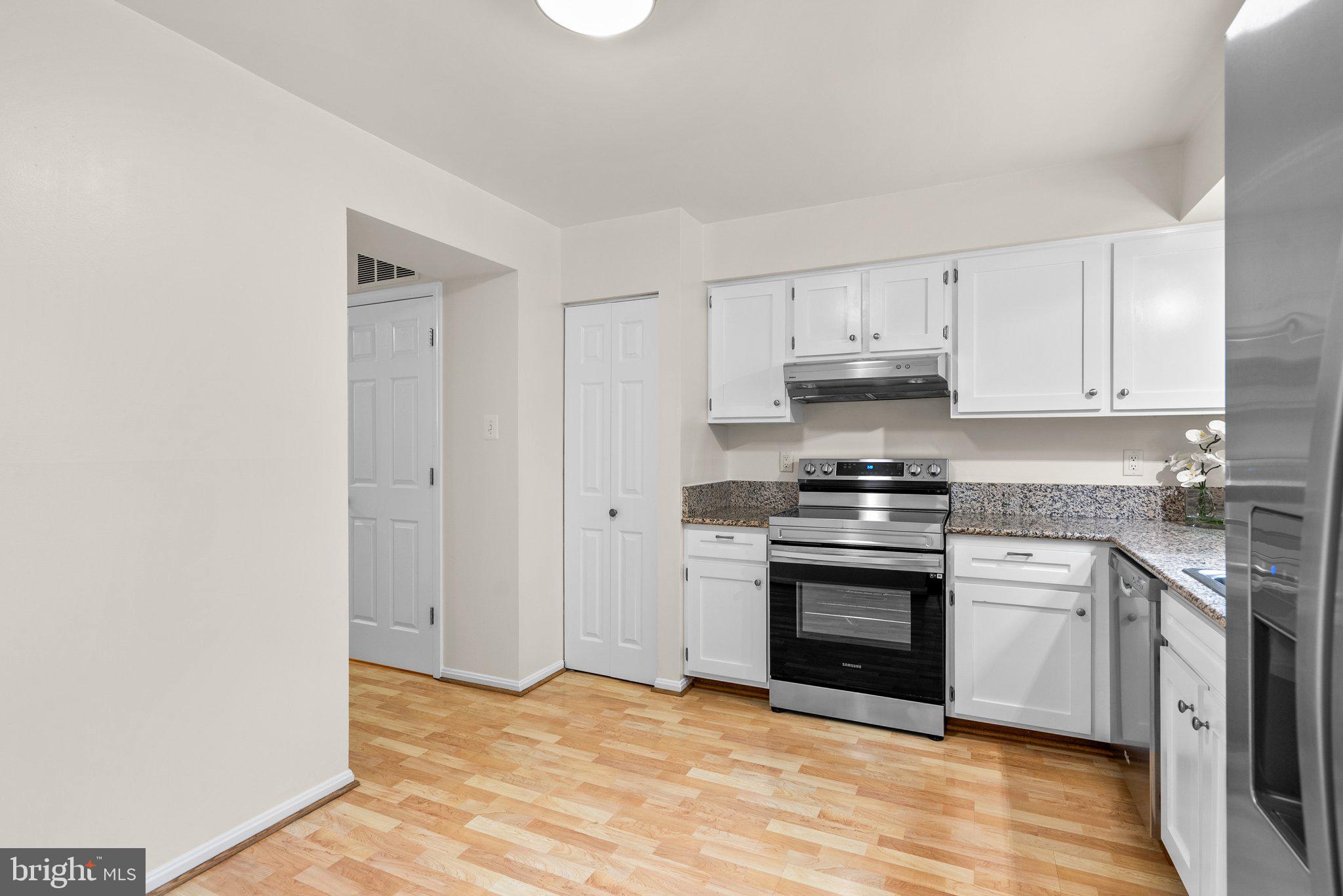 17513 Longview Lane Olney, MD 20832 - Photo 21 of 51 a kitchen with stainless steel appliances granite countertop a stove and a sink