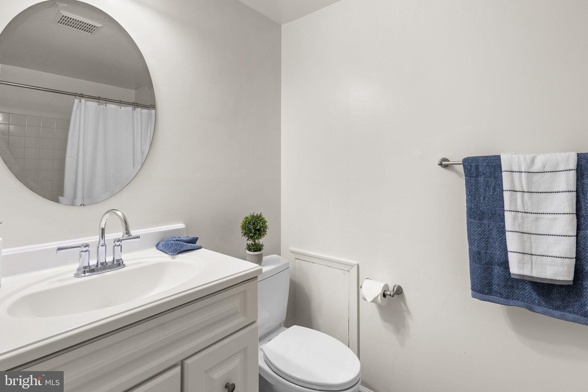 17513 Longview Lane Olney, MD 20832 - Photo 33 of 51 a bathroom with a sink a toilet and mirror