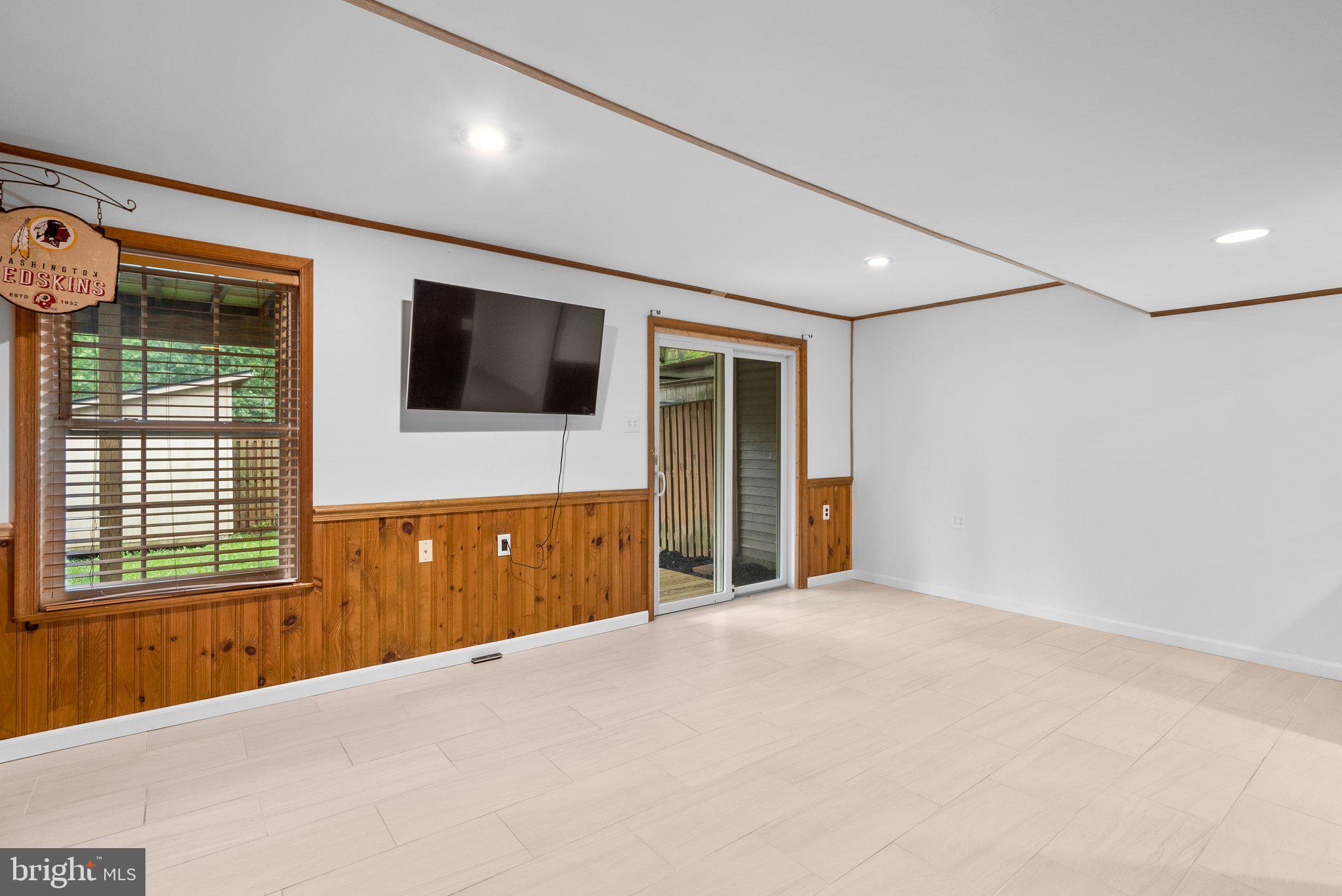 17513 Longview Lane Olney, MD 20832 - Photo 34 of 51 a bedroom with a bed and a flat screen tv