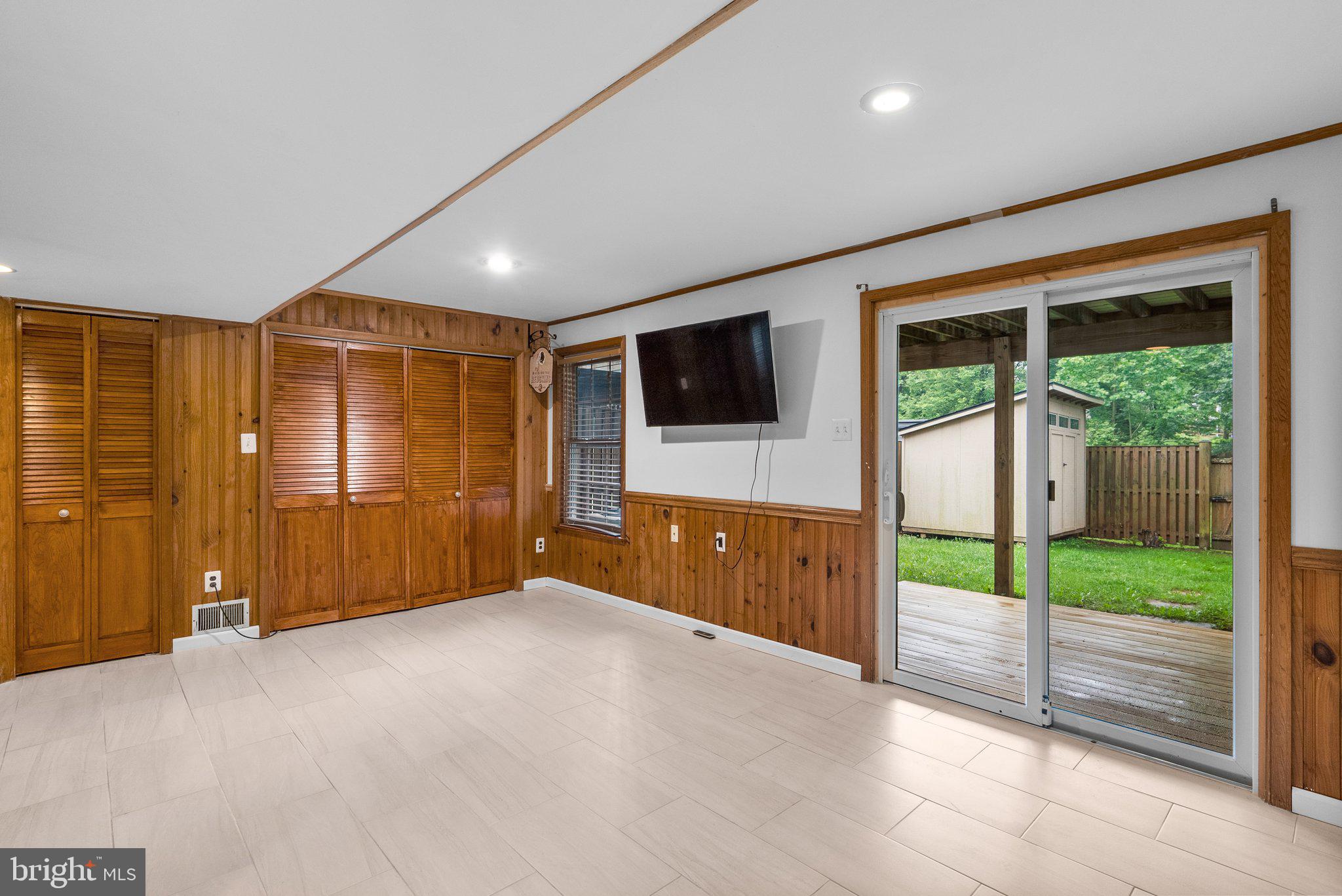 17513 Longview Lane Olney, MD 20832 - Photo 35 of 51 a view of an empty room with wooden floor and a ceiling fan