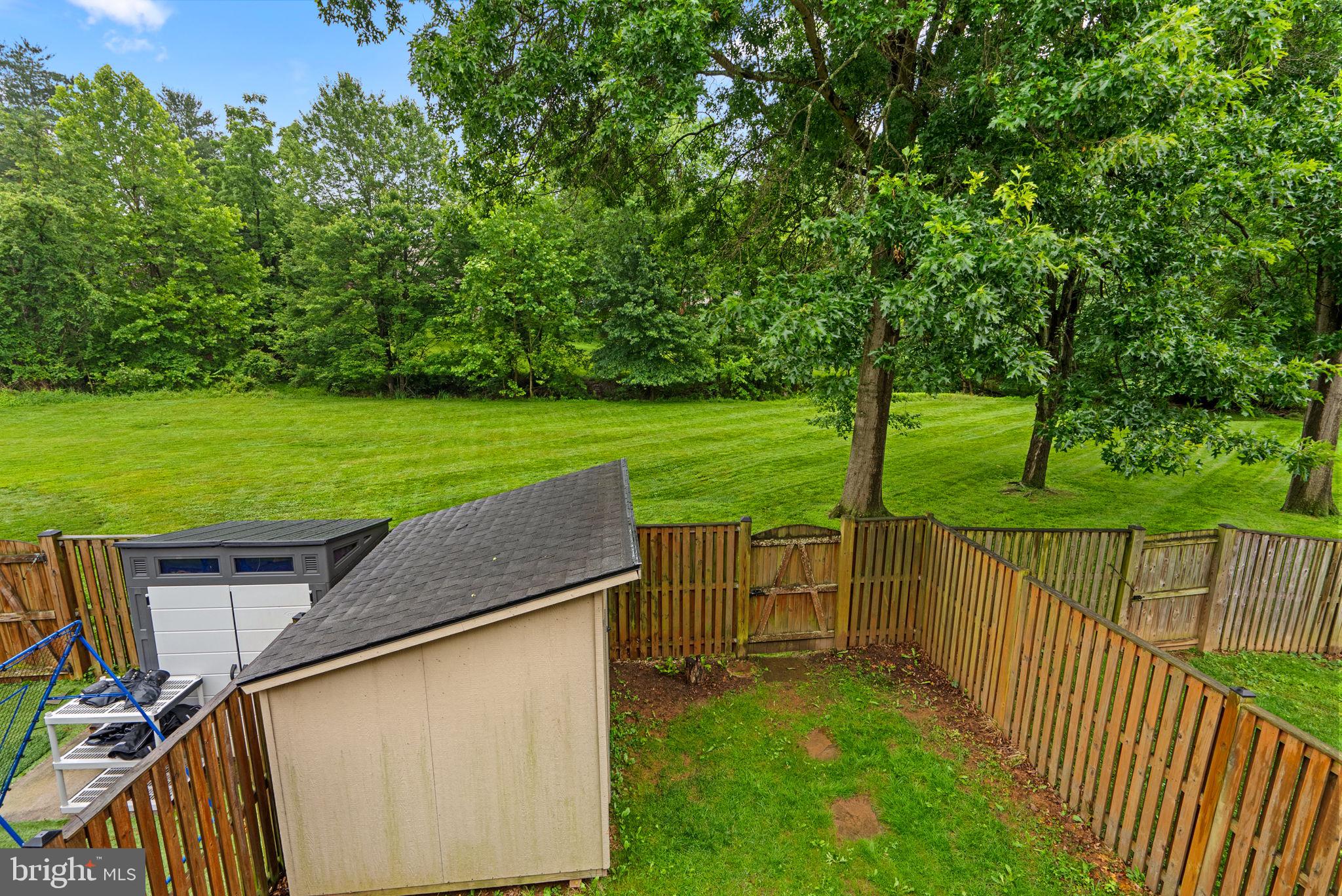 17513 Longview Lane Olney, MD 20832 - Photo 42 of 51 a view of a wooden deck and a garden