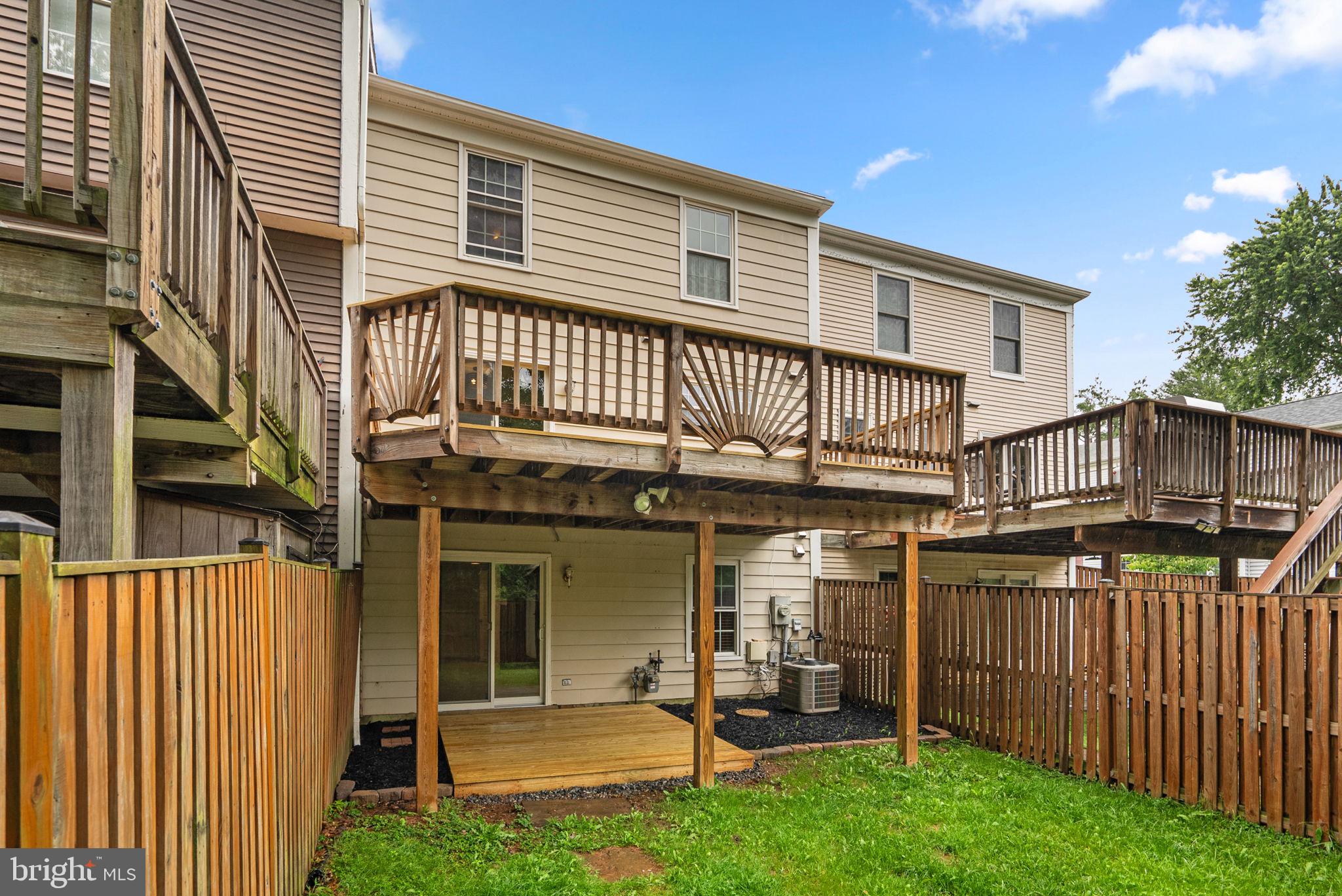17513 Longview Lane Olney, MD 20832 - Photo 45 of 51 a view of a house with wooden deck