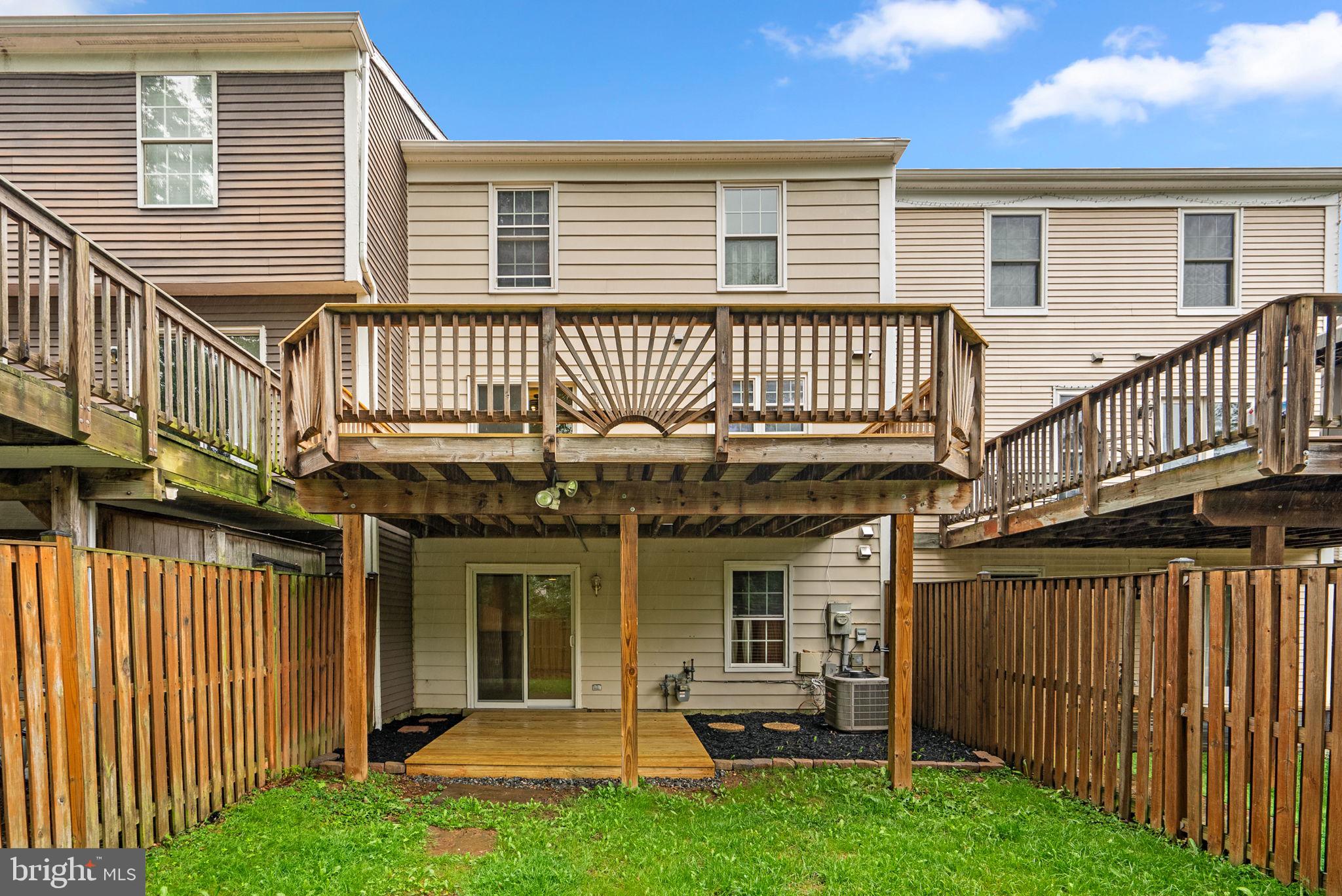 17513 Longview Lane Olney, MD 20832 - Photo 6 of 51 a view of a house with a deck and a large window
