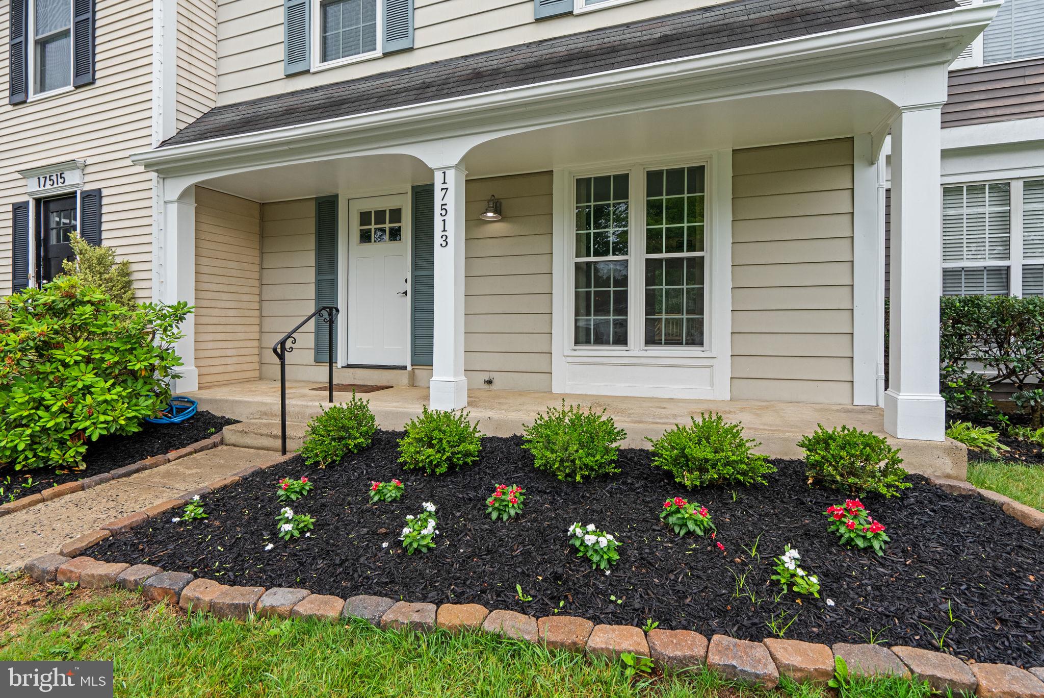 17513 Longview Lane Olney, MD 20832 - Photo 9 of 51 a front view of a house with a garden