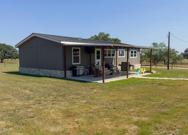 a view of a backyard with a tub