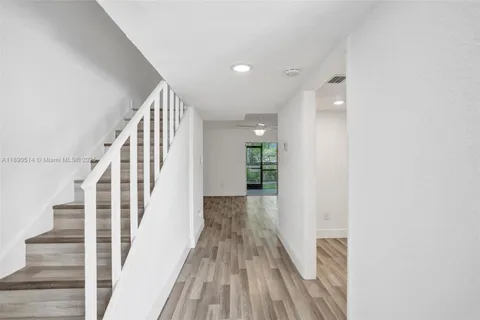 a view of entryway with wooden floor