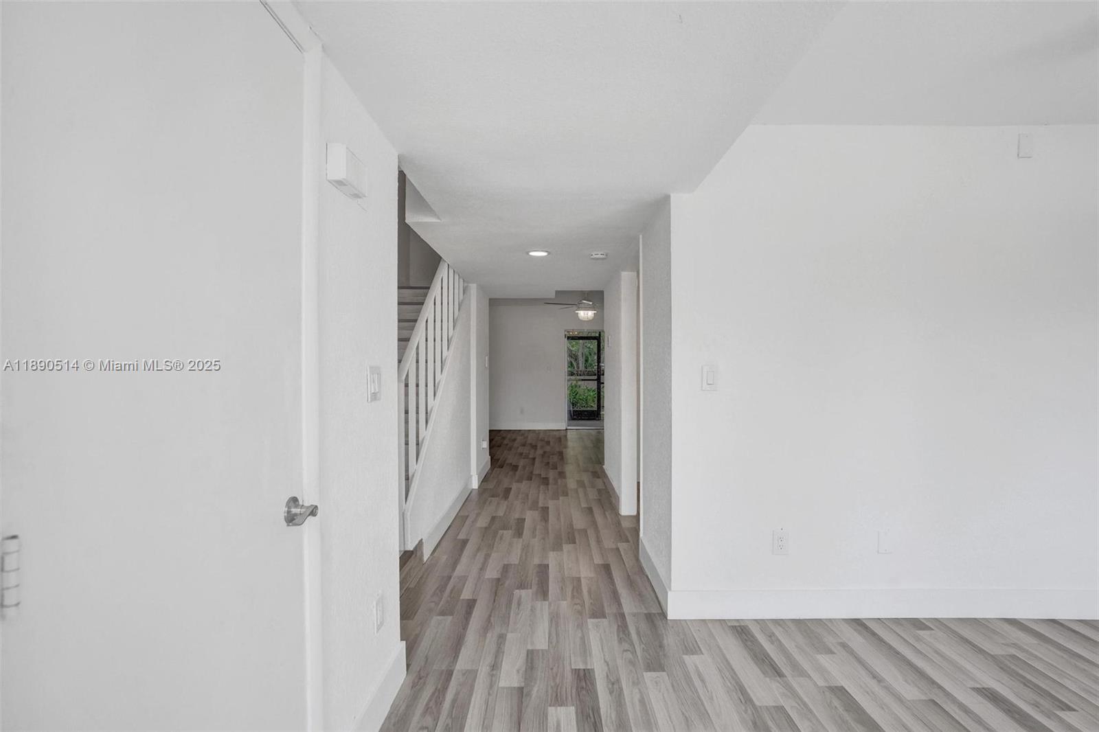 4026 Inverrary Drive, Unit 8A Lauderhill, FL 33319 - Photo 17 of 50 a view of a hallway with wooden floor