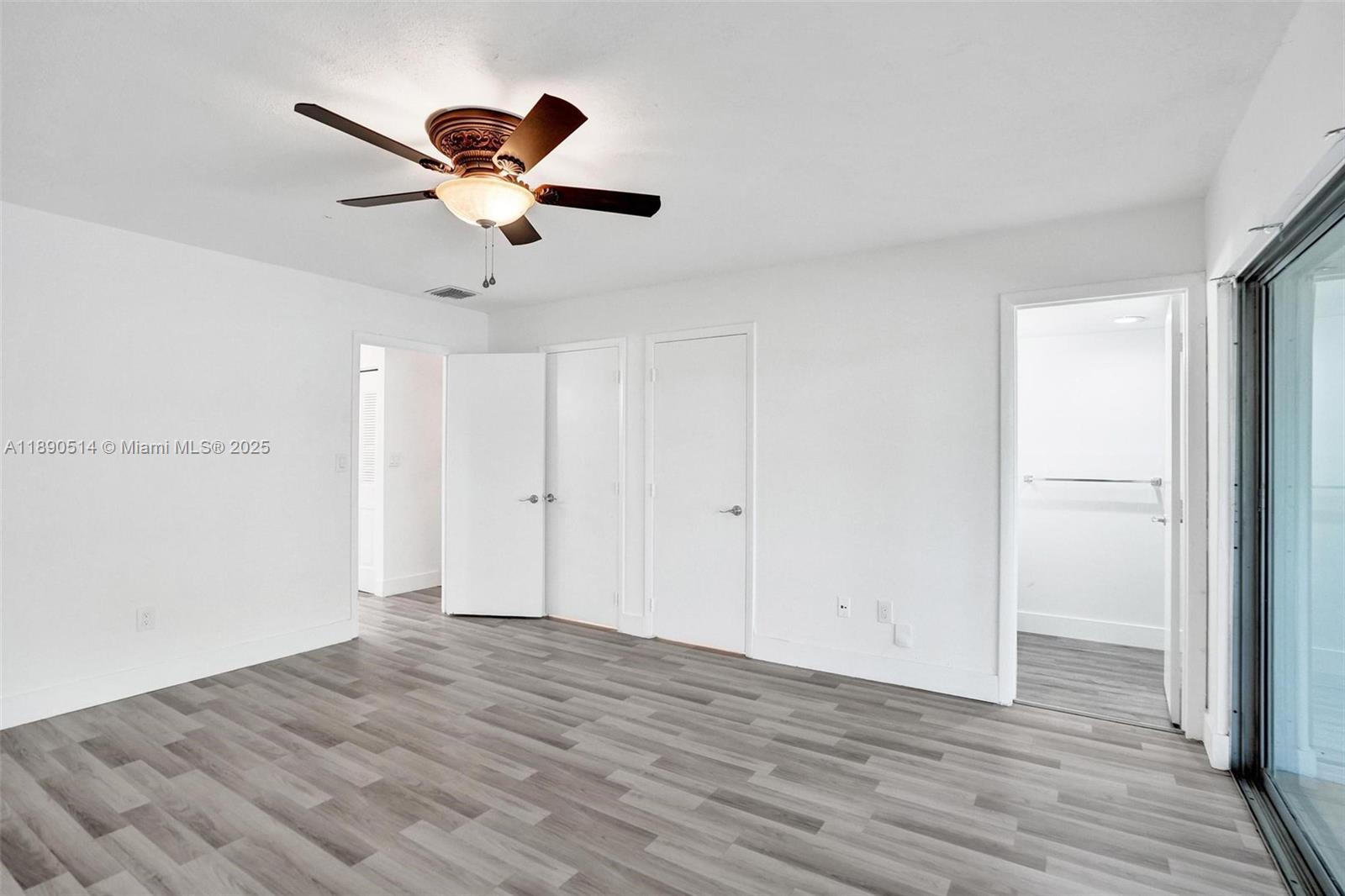 4026 Inverrary Drive, Unit 8A Lauderhill, FL 33319 - Photo 23 of 50 a view of empty room with wooden floor