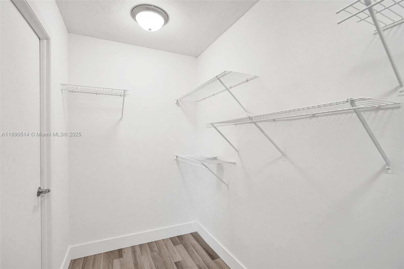 4026 Inverrary Drive, Unit 8A Lauderhill, FL 33319 - Photo 26 of 50 a view of a room with racks on the wall