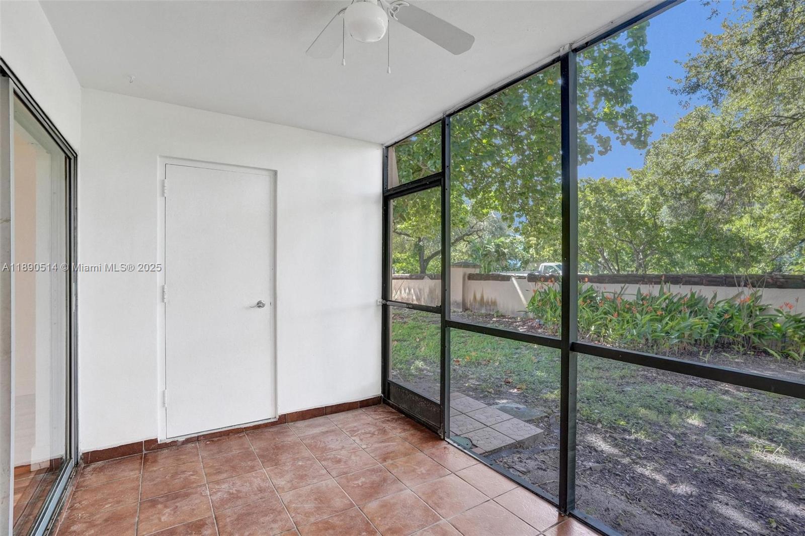 4026 Inverrary Drive, Unit 8A Lauderhill, FL 33319 - Photo 33 of 50 an empty room with large windows
