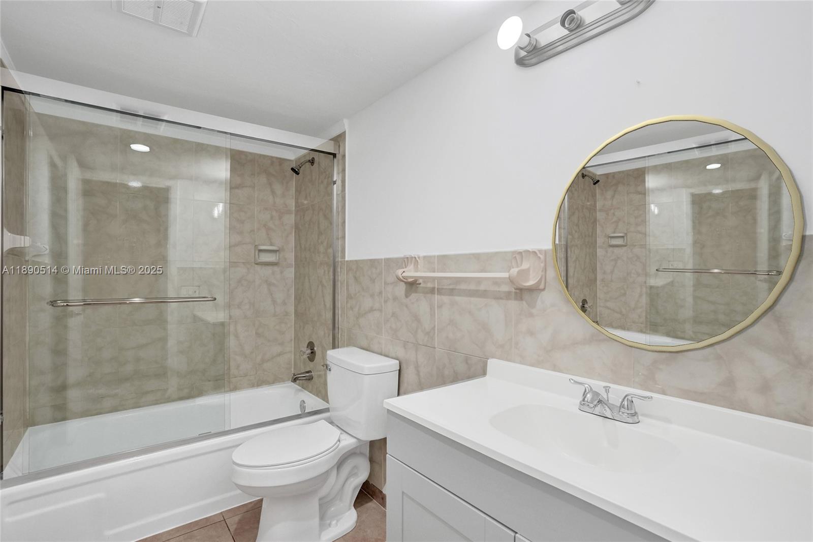 4026 Inverrary Drive, Unit 8A Lauderhill, FL 33319 - Photo 34 of 50 a bathroom with a sink toilet and shower