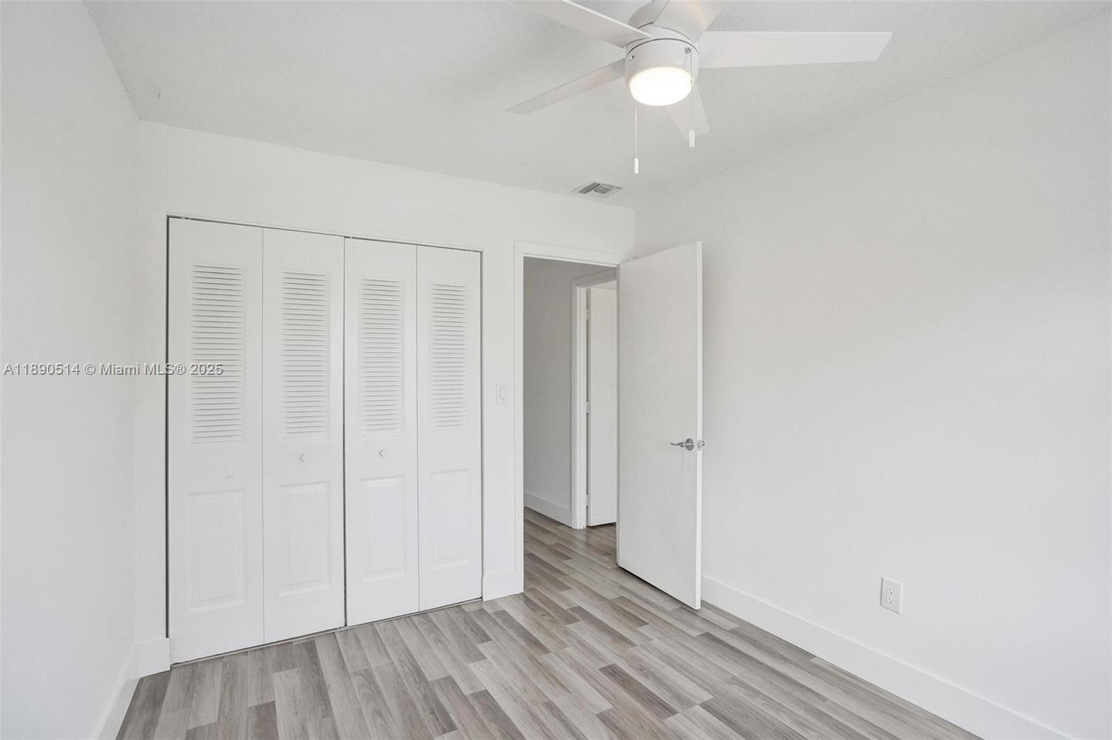 4026 Inverrary Drive, Unit 8A Lauderhill, FL 33319 - Photo 39 of 50 wooden floor in an empty room