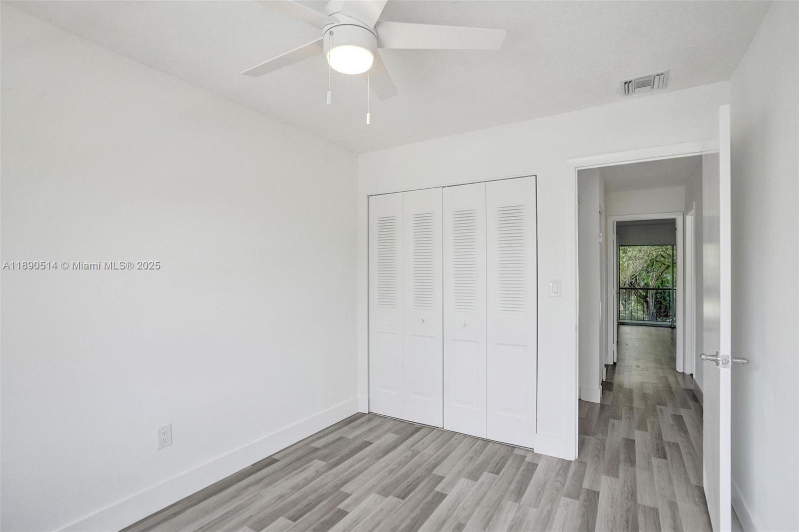 4026 Inverrary Drive, Unit 8A Lauderhill, FL 33319 - Photo 40 of 50 a view of an empty room with wooden floor