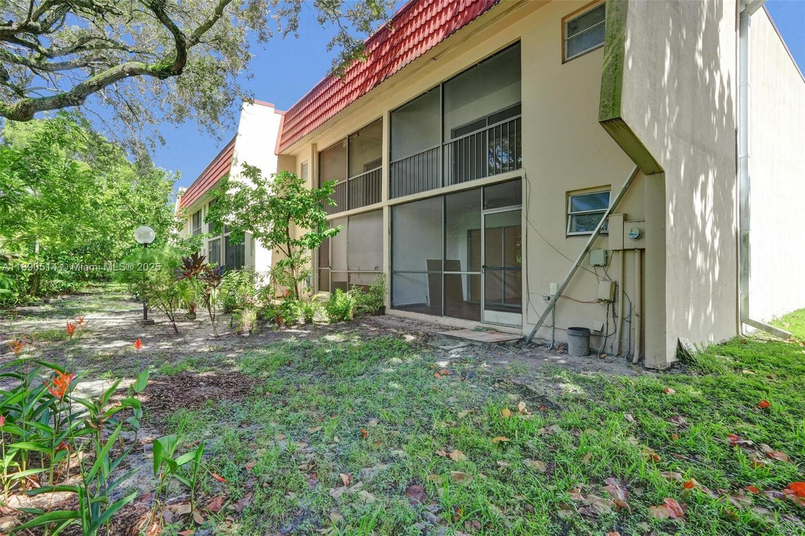 4026 Inverrary Drive, Unit 8A Lauderhill, FL 33319 - Photo 42 of 50 a view of a house with a yard