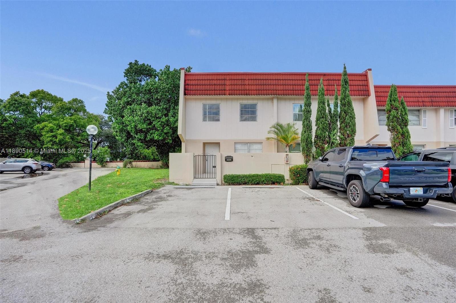 4026 Inverrary Drive, Unit 8A Lauderhill, FL 33319 - Photo 7 of 50 a car parked in front of a house