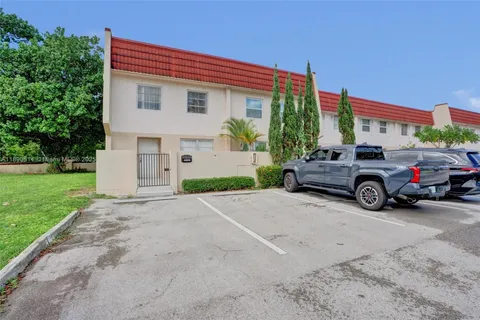 a view of a car in front of a house