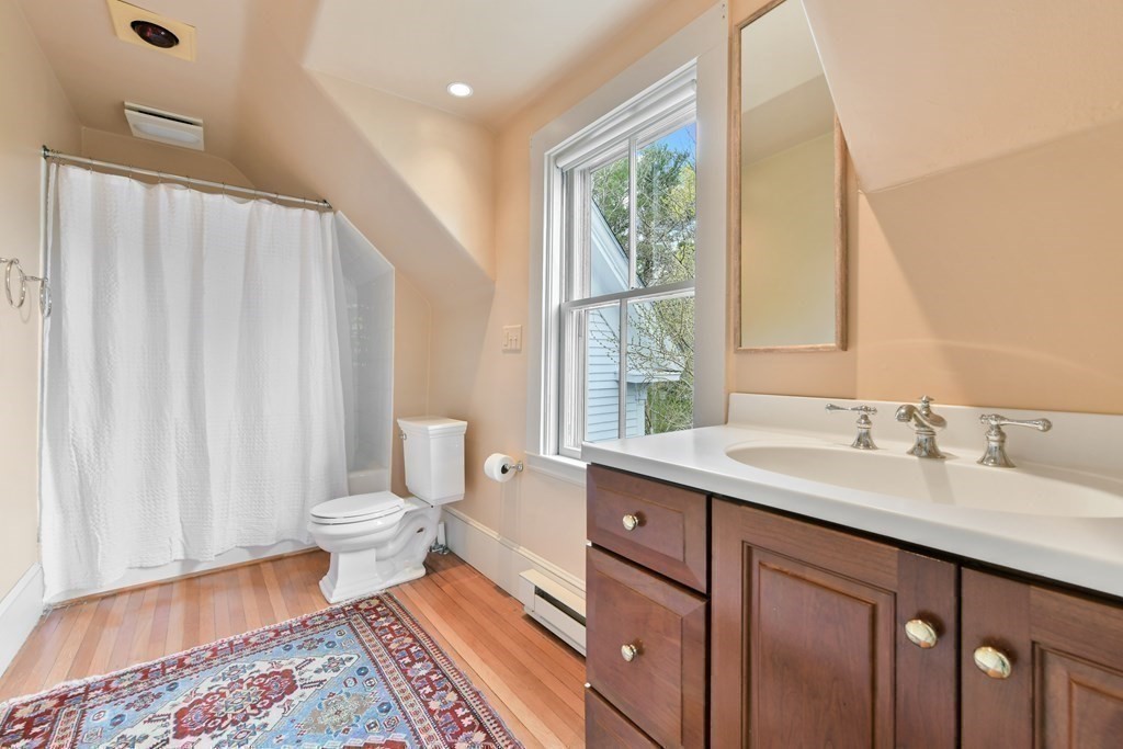 241 Central Street Hingham, MA 02043 - Photo 15 of 24 a spacious bathroom with a sink a toilet and a window