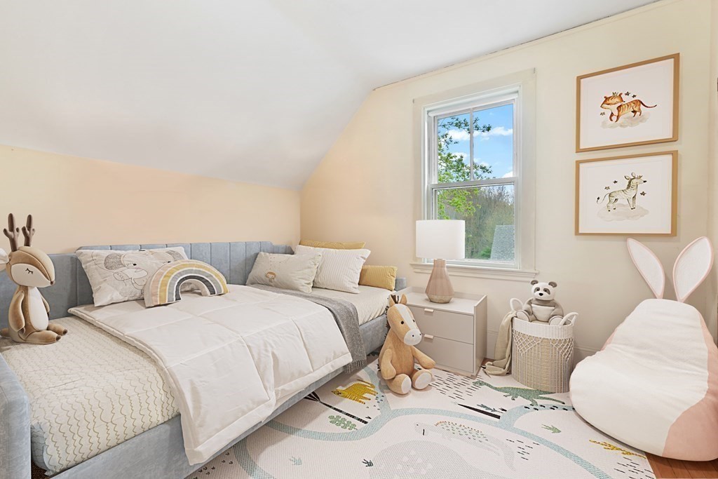 241 Central Street Hingham, MA 02043 - Photo 19 of 24 a bedroom with a bed and a couch