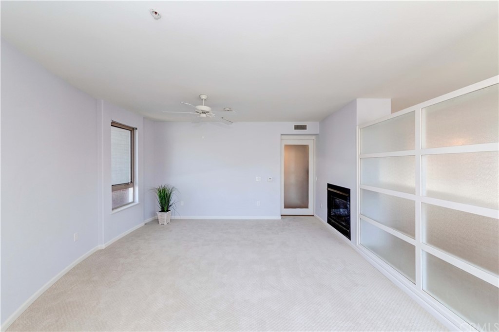 100 South Alameda Street, Unit 210 Los Angeles, CA 90012 - Photo 17 of 52 a view of an empty room with a fireplace