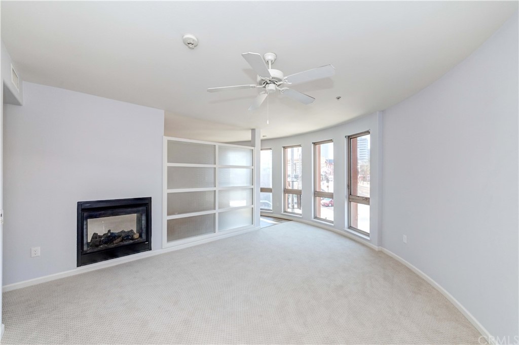 100 South Alameda Street, Unit 210 Los Angeles, CA 90012 - Photo 19 of 52 a view of an empty room with a fireplace and a window
