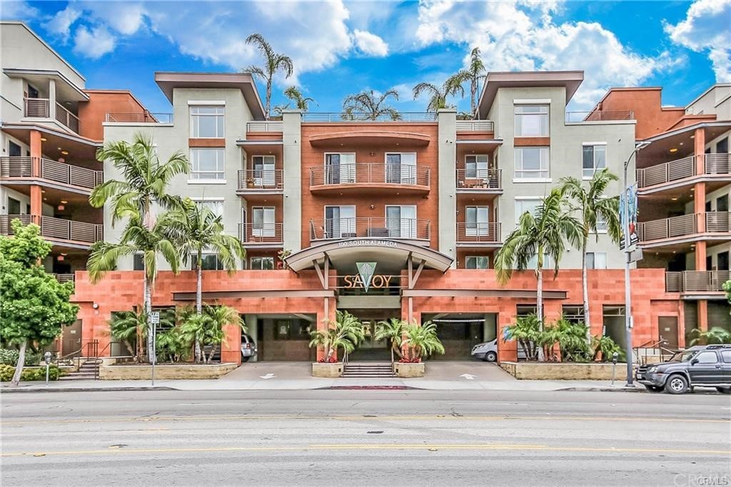 100 South Alameda Street, Unit 210 Los Angeles, CA 90012 - Photo 2 of 52 a front view of multi story residential apartment building
