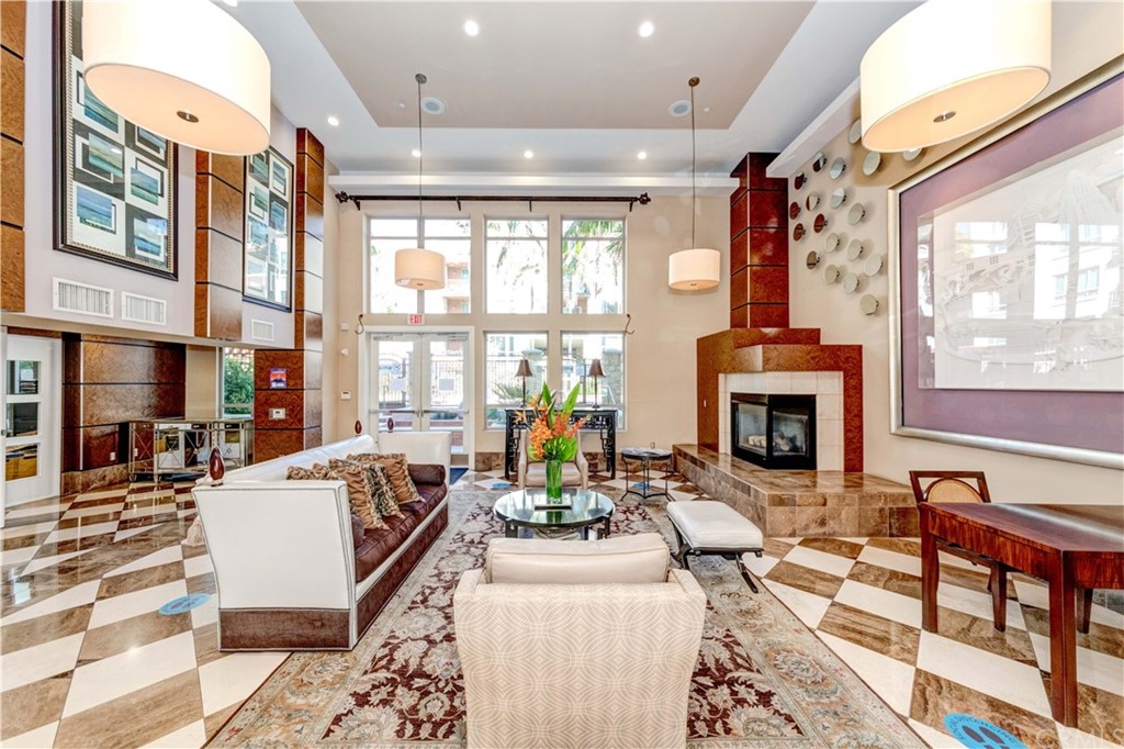 100 South Alameda Street, Unit 210 Los Angeles, CA 90012 - Photo 27 of 52 a living room with fireplace furniture and a large window