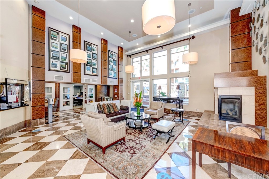 100 South Alameda Street, Unit 210 Los Angeles, CA 90012 - Photo 28 of 52 a living room with fireplace furniture and a large window