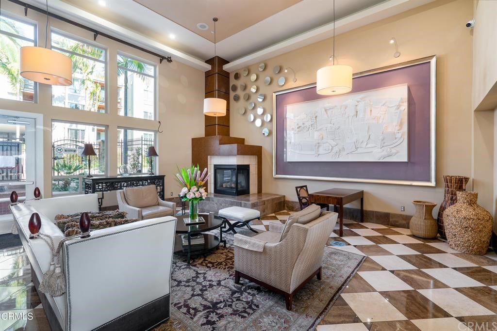 100 South Alameda Street, Unit 210 Los Angeles, CA 90012 - Photo 29 of 52 a living room with fireplace furniture and a large window
