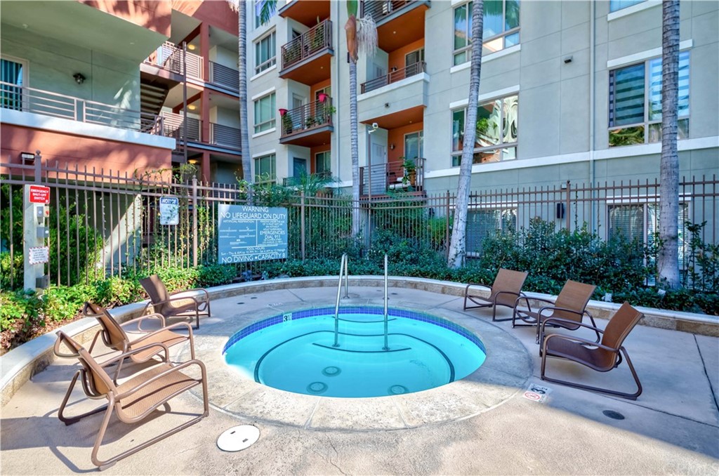 100 South Alameda Street, Unit 210 Los Angeles, CA 90012 - Photo 31 of 52 a view of a house with a swimming pool and sitting area