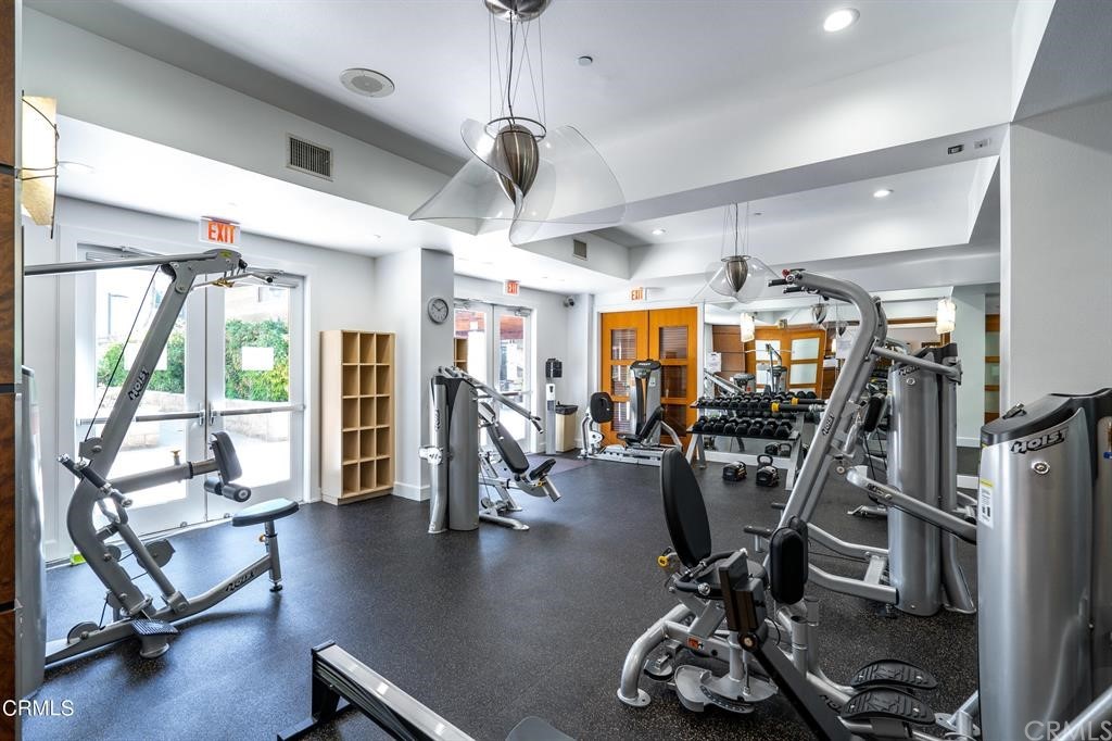 100 South Alameda Street, Unit 210 Los Angeles, CA 90012 - Photo 40 of 52 a view of a room with gym equipment