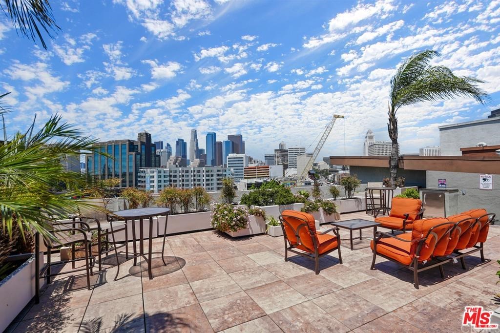 100 South Alameda Street, Unit 210 Los Angeles, CA 90012 - Photo 43 of 52 a building outdoor space with patio furniture and potted plants