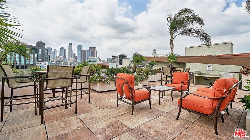 100 South Alameda Street, Unit 210 Los Angeles, CA 90012 - Photo 44 of 52 an outdoor sitting area with furniture and barbeque grill