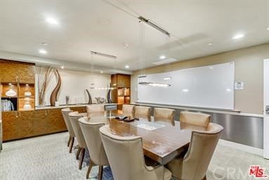 100 South Alameda Street, Unit 210 Los Angeles, CA 90012 - Photo 47 of 52 a view of a dining room with furniture and wooden floor