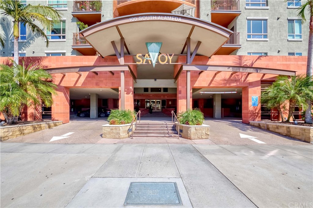 100 South Alameda Street, Unit 210 Los Angeles, CA 90012 - Photo 50 of 52 front view of a building with a garden area