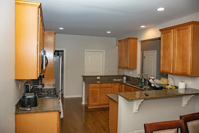 a kitchen with a sink and a refrigerator