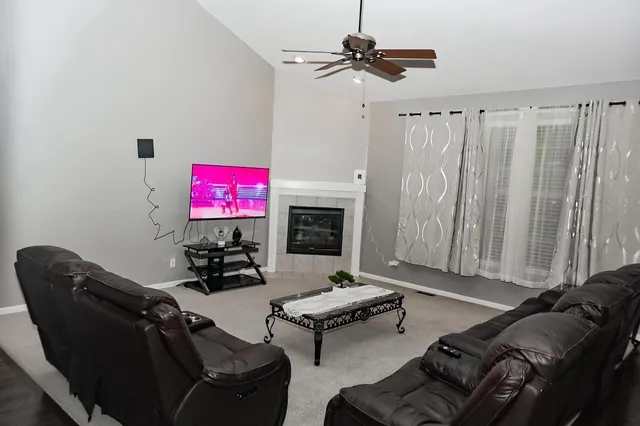a living room with furniture and a flat screen tv