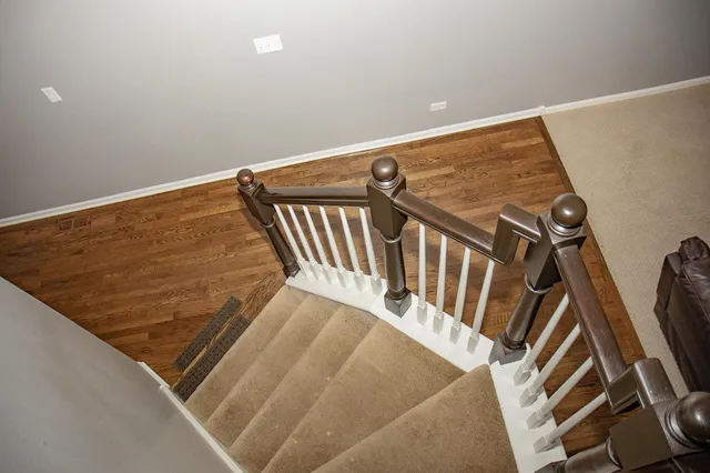 a view of a livingroom with furniture and staircase